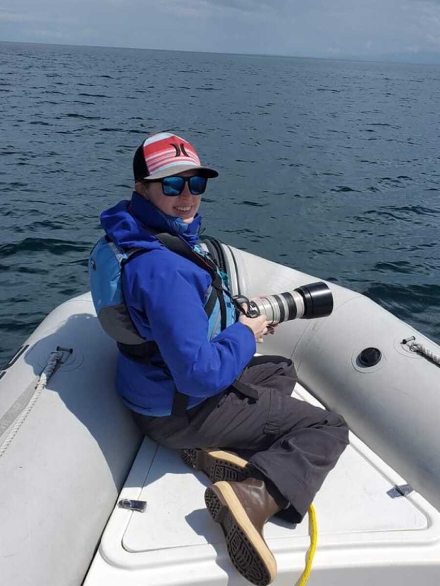 woman on a boat with a camera