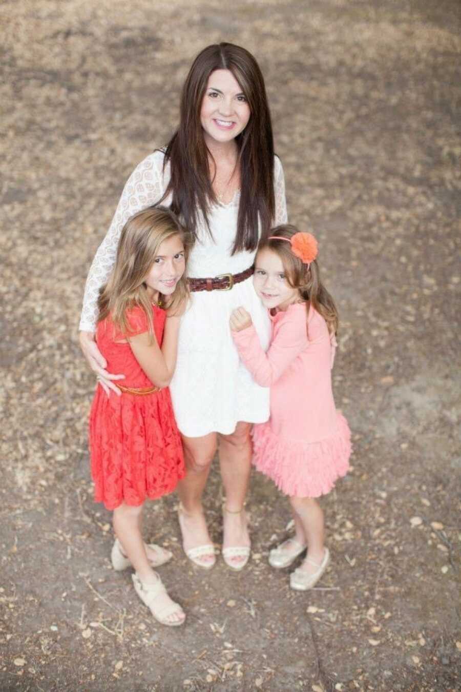 woman with her two young daughters