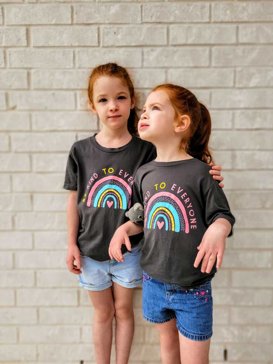 two daughters wearing the same shirt