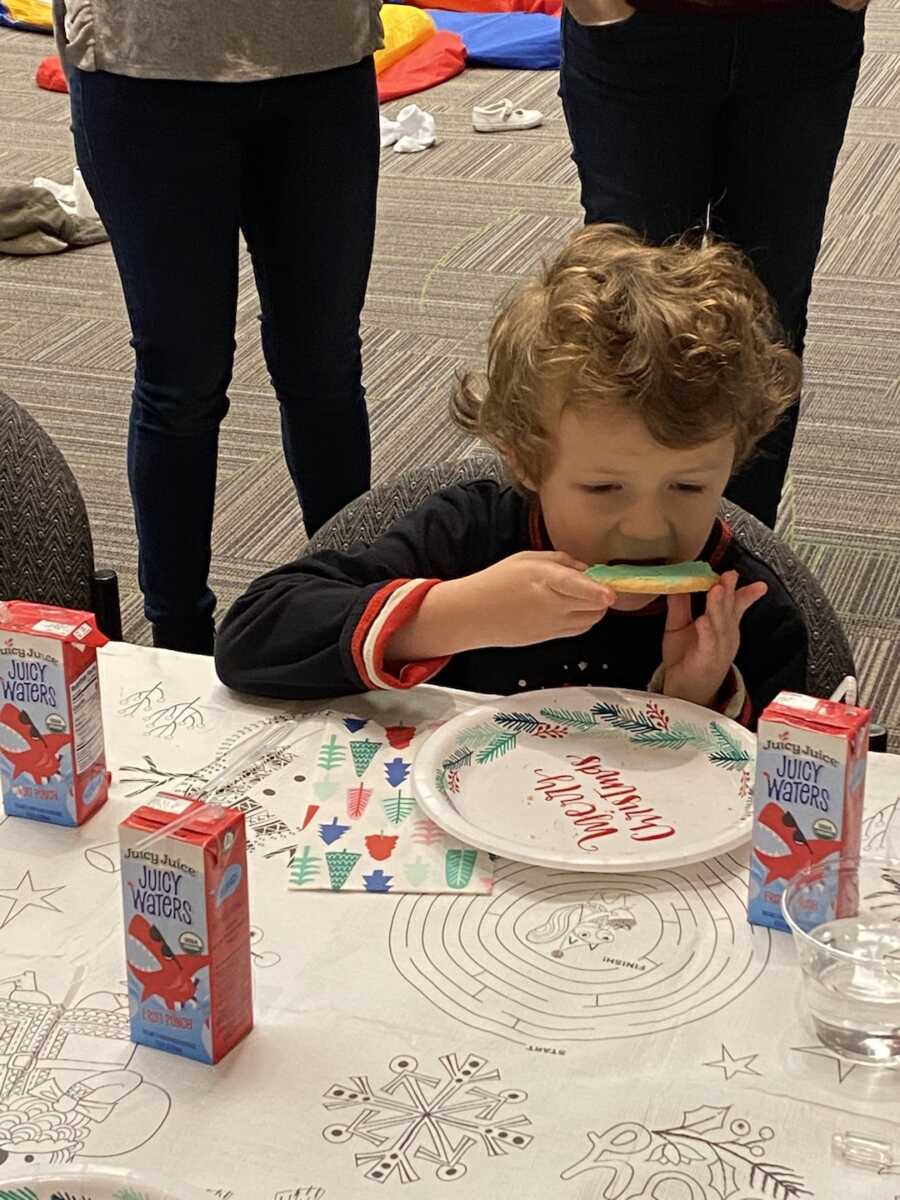 little boy eating cookie