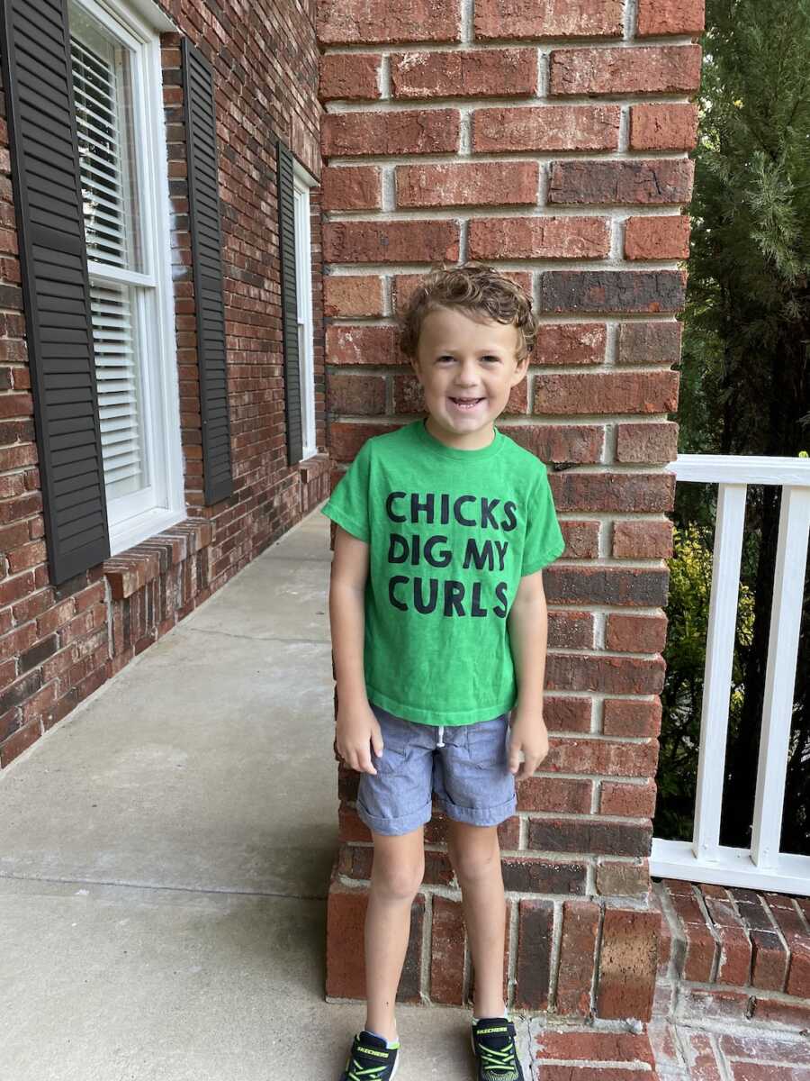 little boy in green shirt 