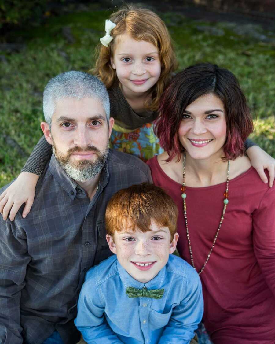 family photo looking up at camera 