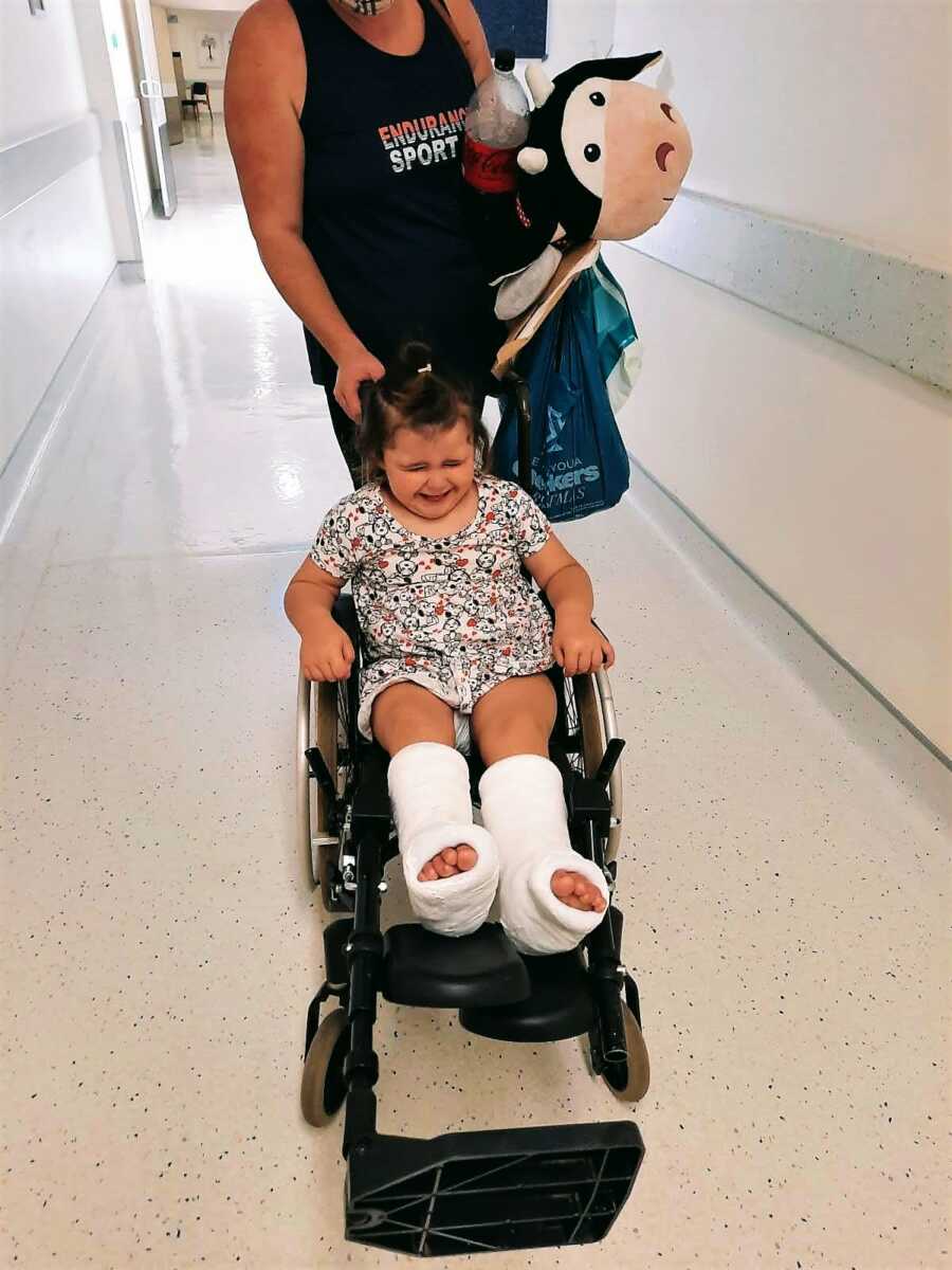 little girl with casts on in the hosptial