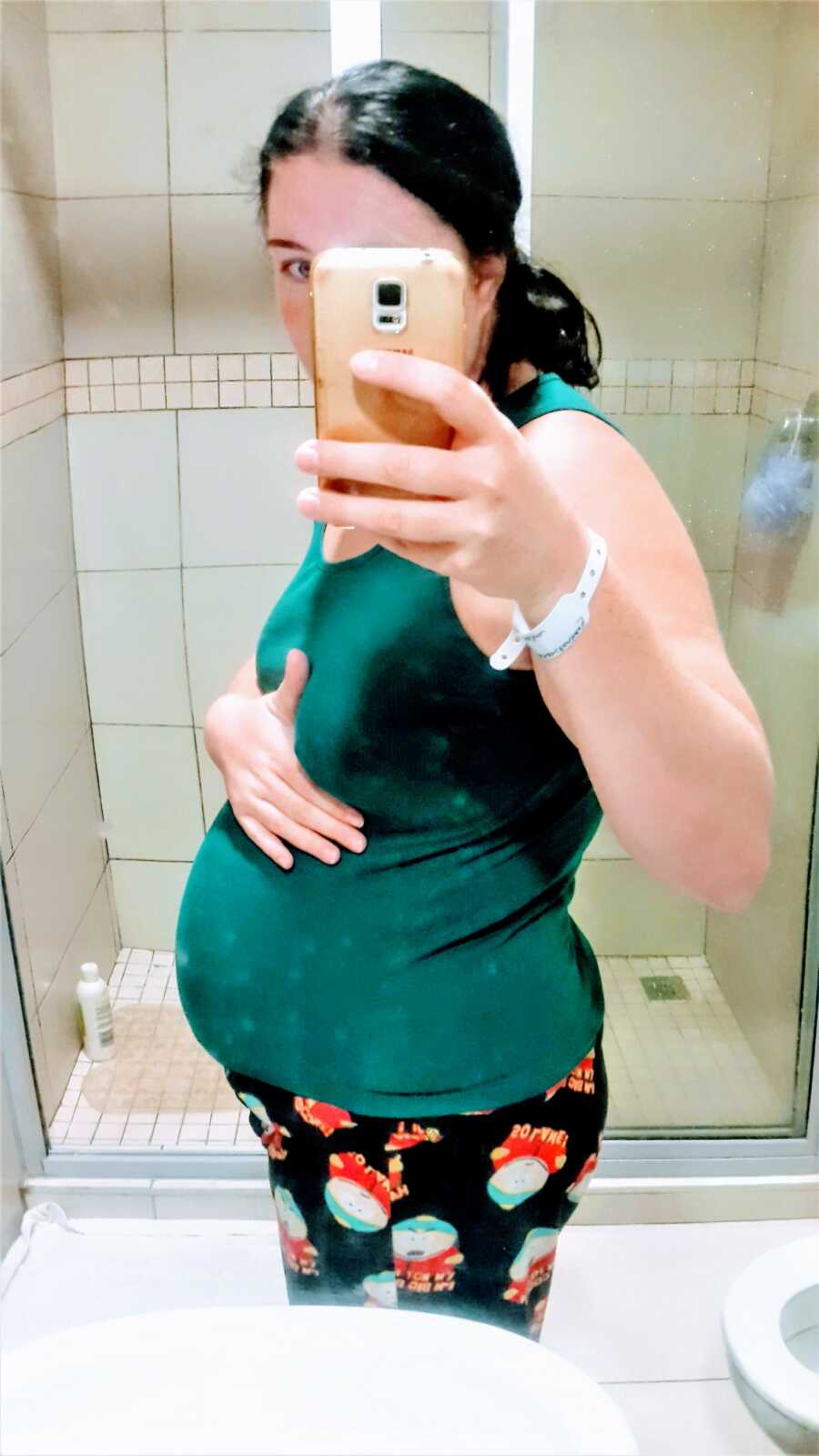 woman showing off her pregnant belly