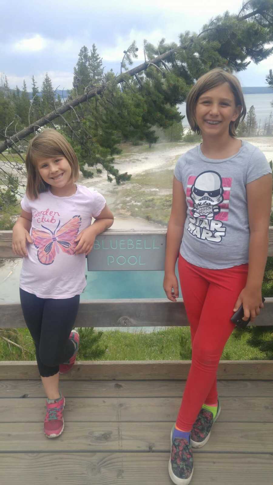 young sisters smiling for photo 