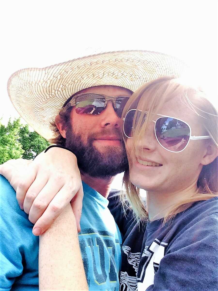 selfie of a man and a woman on a date wearing sunglasses 