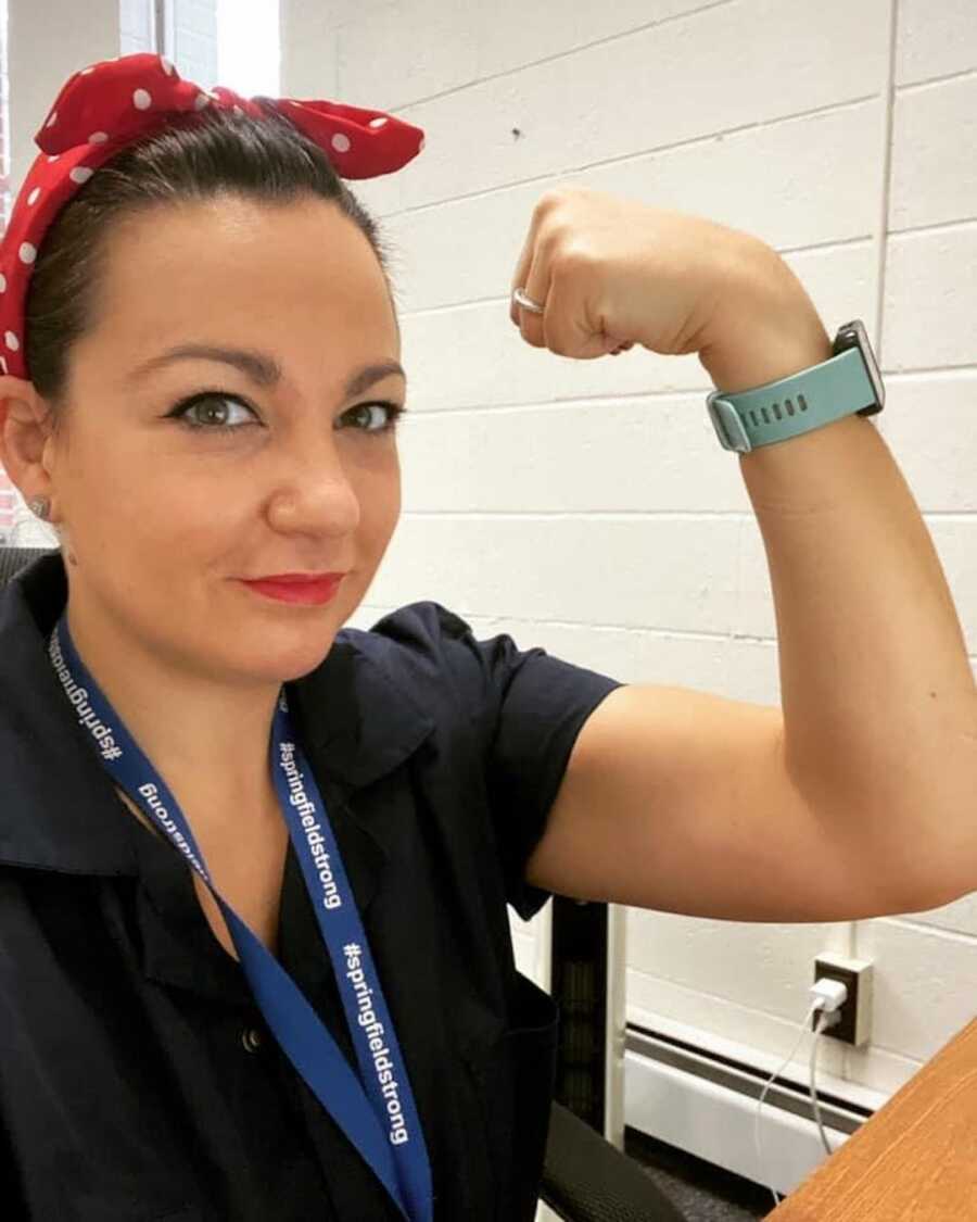 woman with her arm flexed 