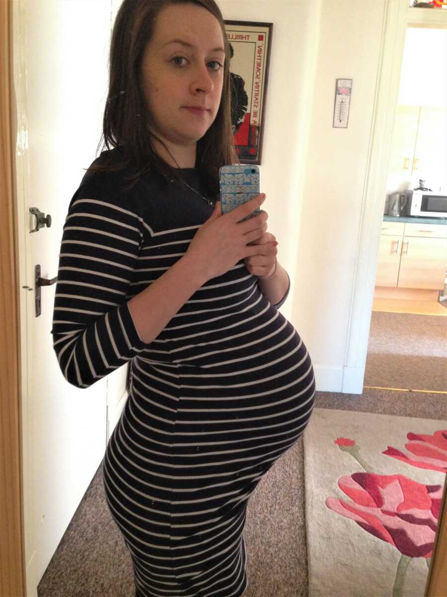 woman showing off her pregnant belly