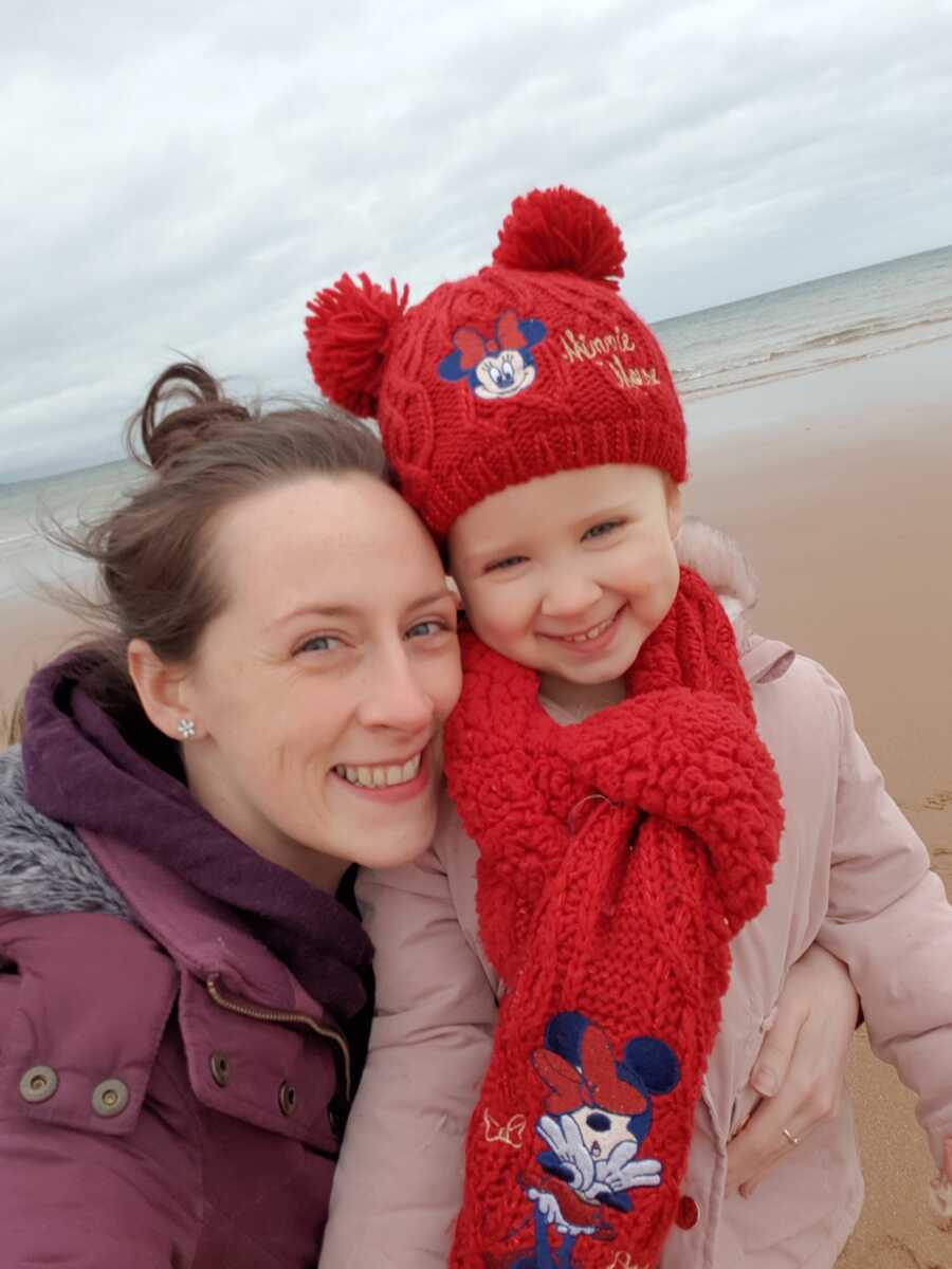 mom and daughter on the beach