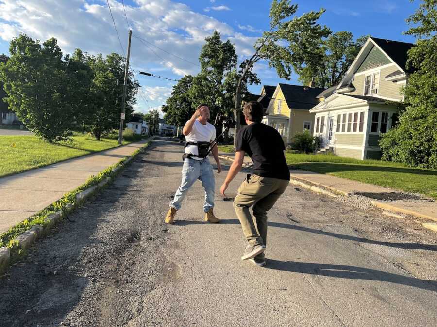 man on street shooting music video 