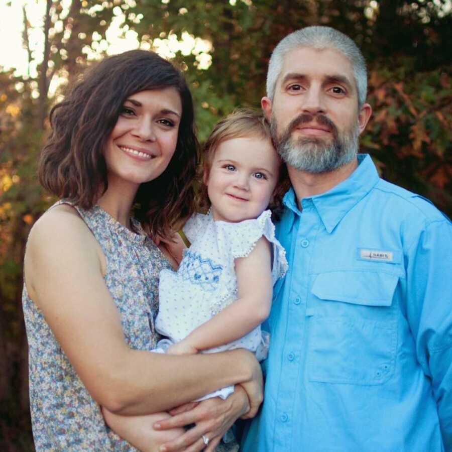 mother and father with adopted daughter 