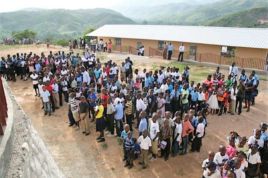 Large crowd of Haitian children forming lines at their school in Bellevue  Mountain