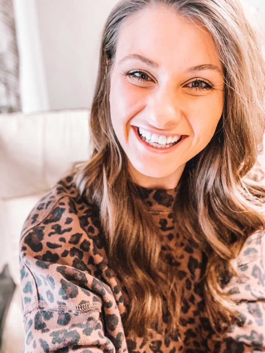 Woman recovering from alcoholism takes a selfie looking happy and sober