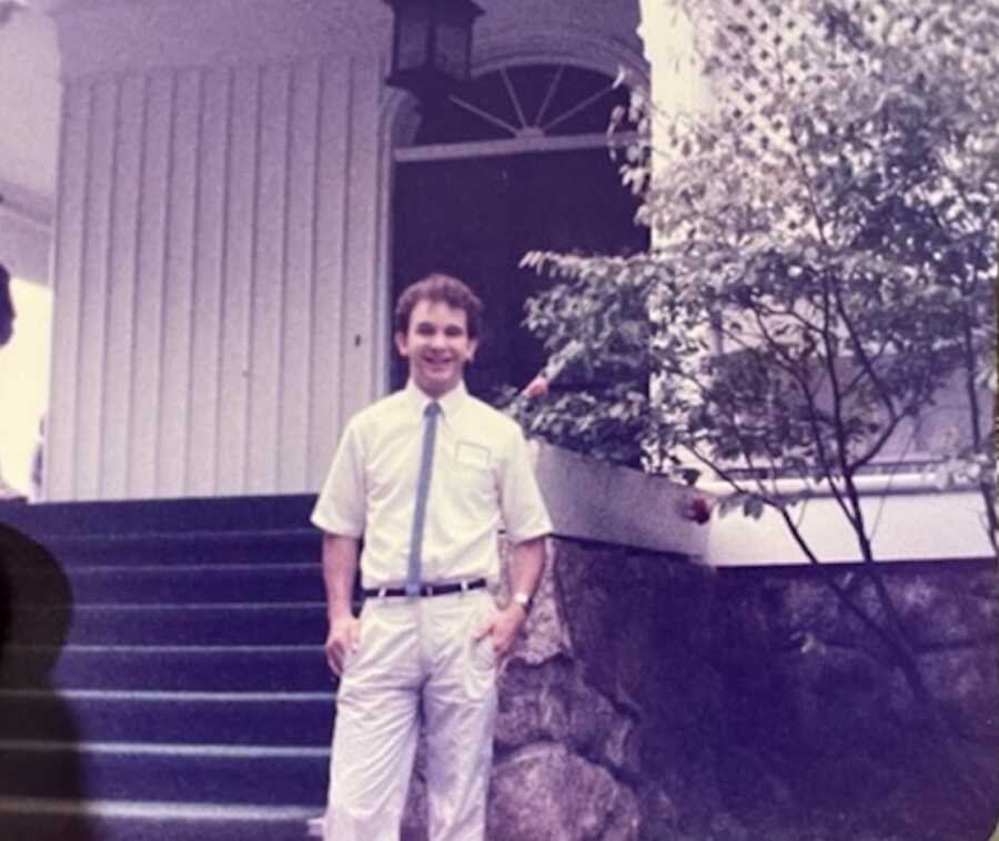 Young Chip in front of building 