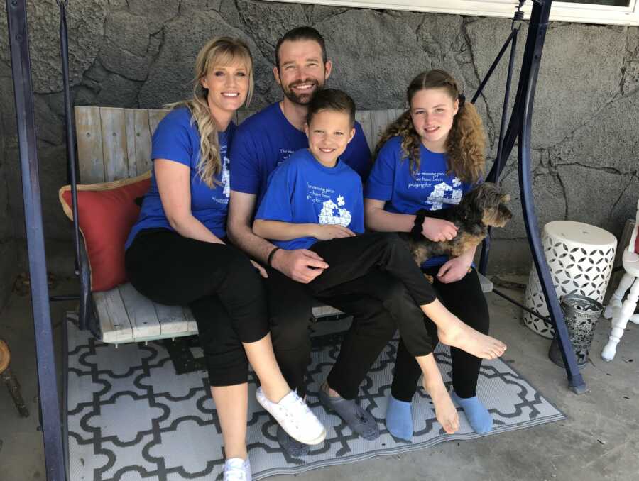 mom and dad with their children and foundation shirts