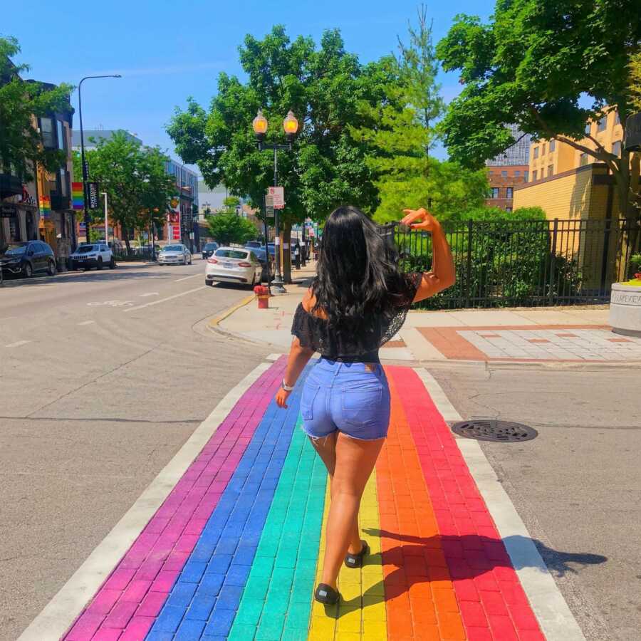 woman walking on the pride path