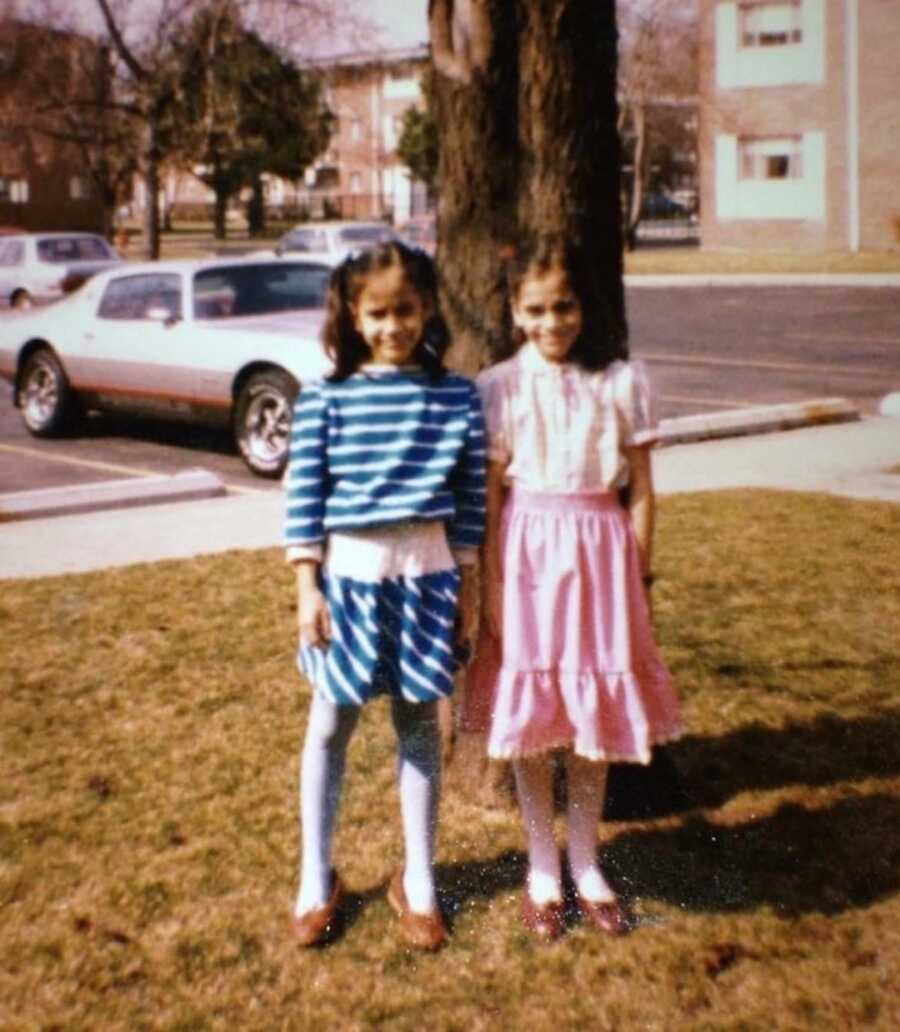 young twins standing for photo