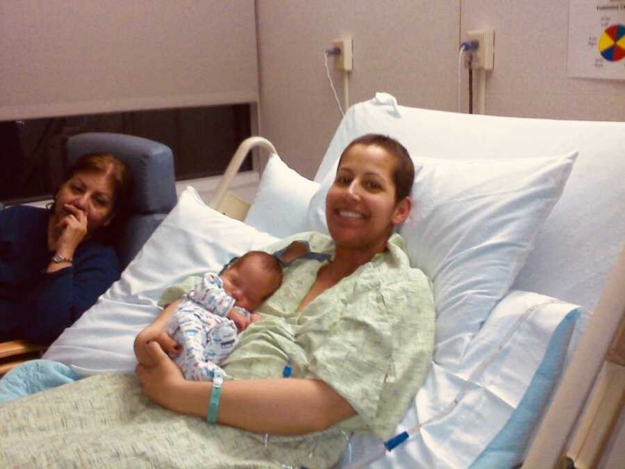 woman in hospital bed with newborn child 