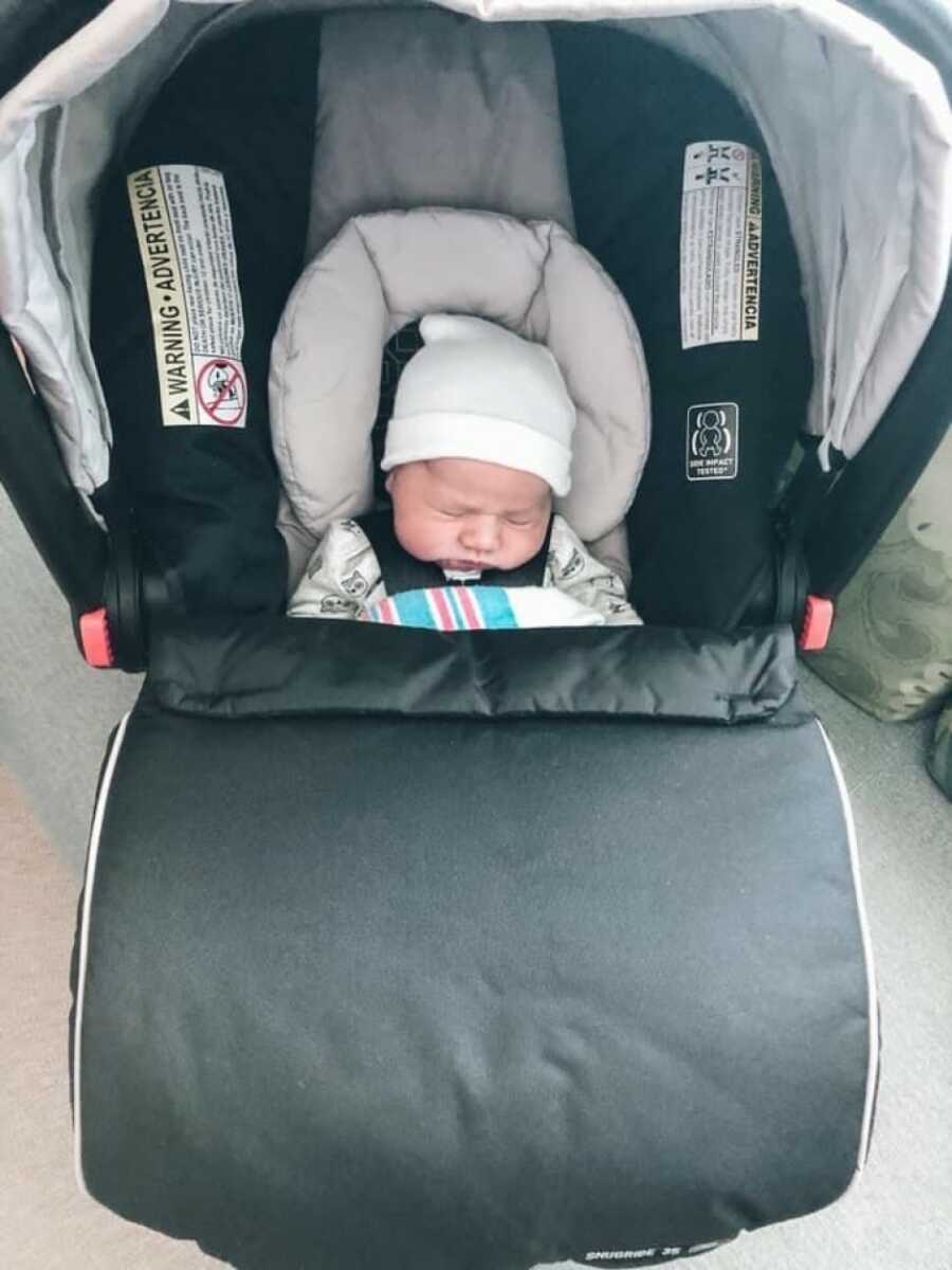 new born in his stroller