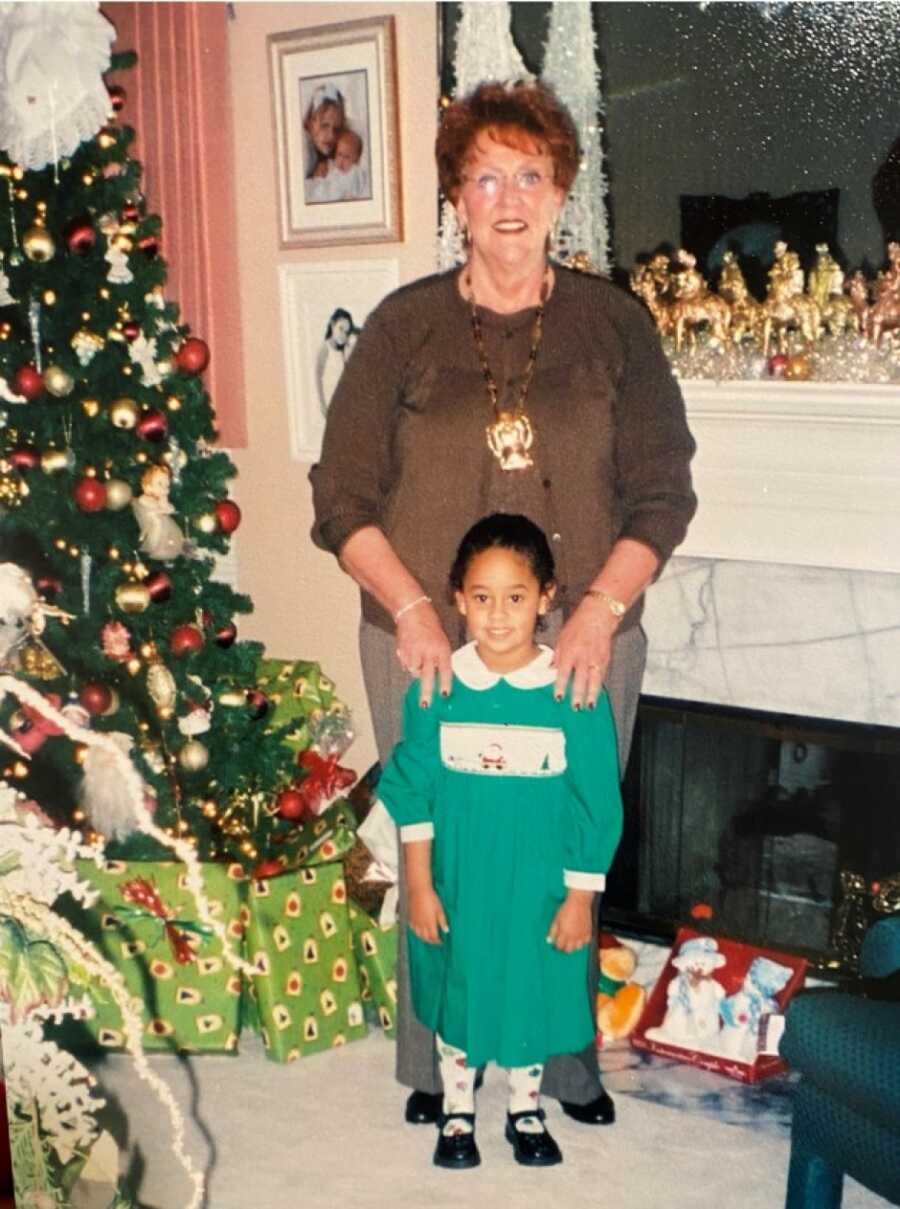 Little girl takes Christmas picture with grandma who she lived with for a time after her mom relapsed.