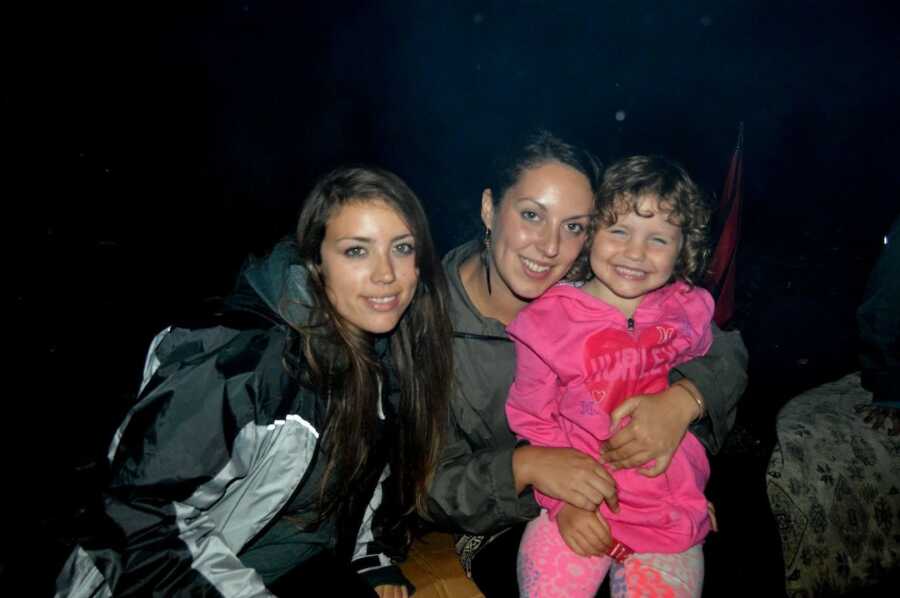 sisters and daughter taking photo together