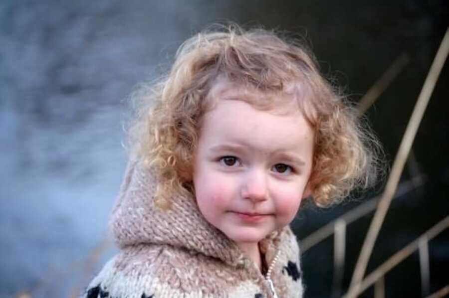 young girl smiling for photo