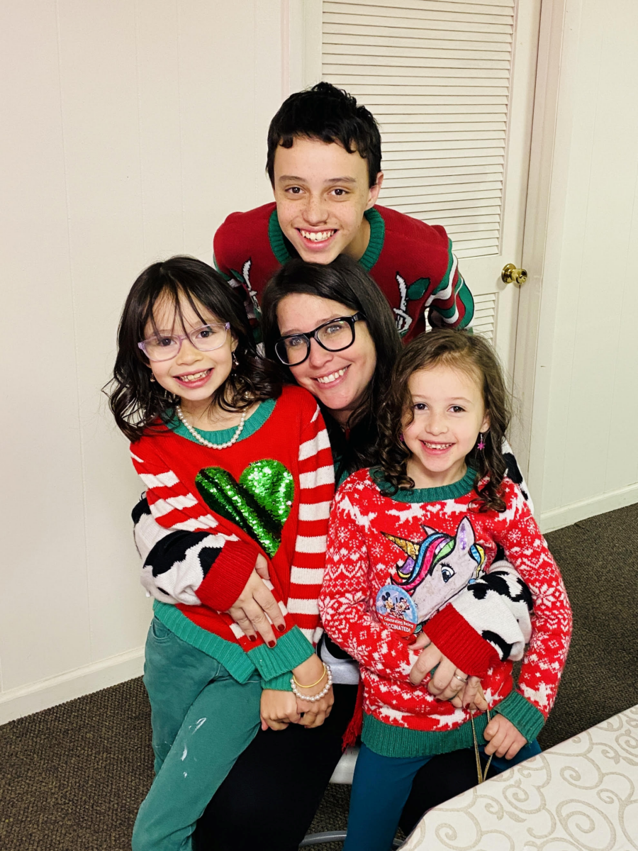 mom with her children in sweaters