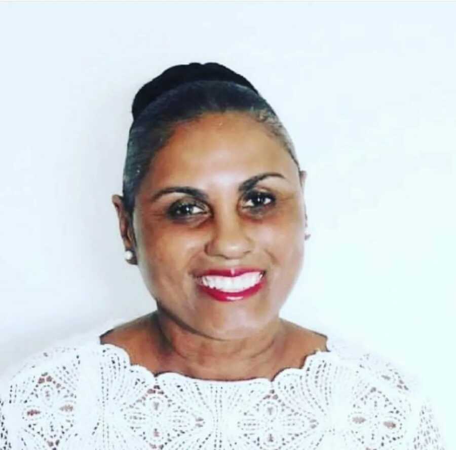 headshot of woman in white shirt 