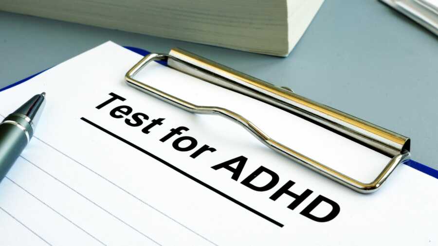 Clipboard with a test for ADHD on a desk.