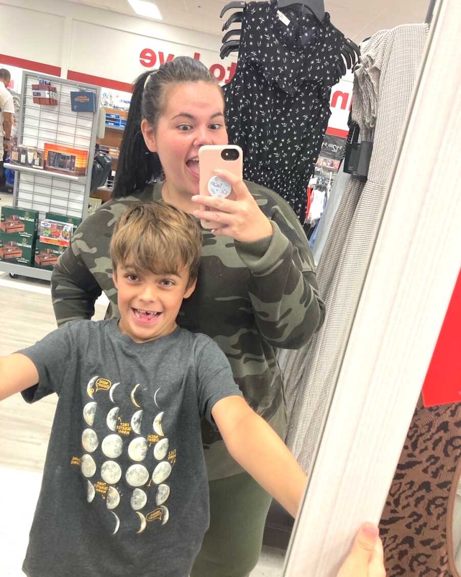 mom takes mirror selfie with her younger son
