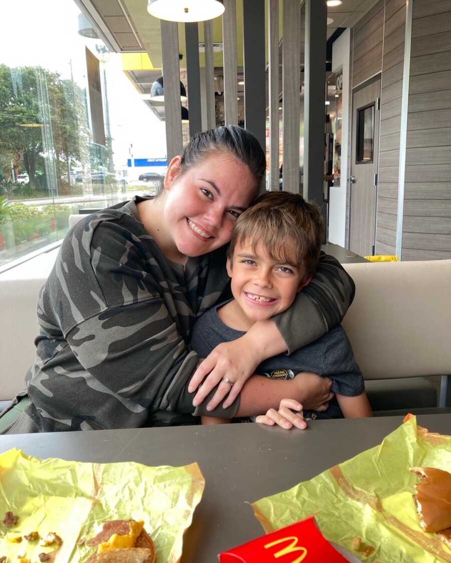 mom embraces her son in foster care during visitation hours