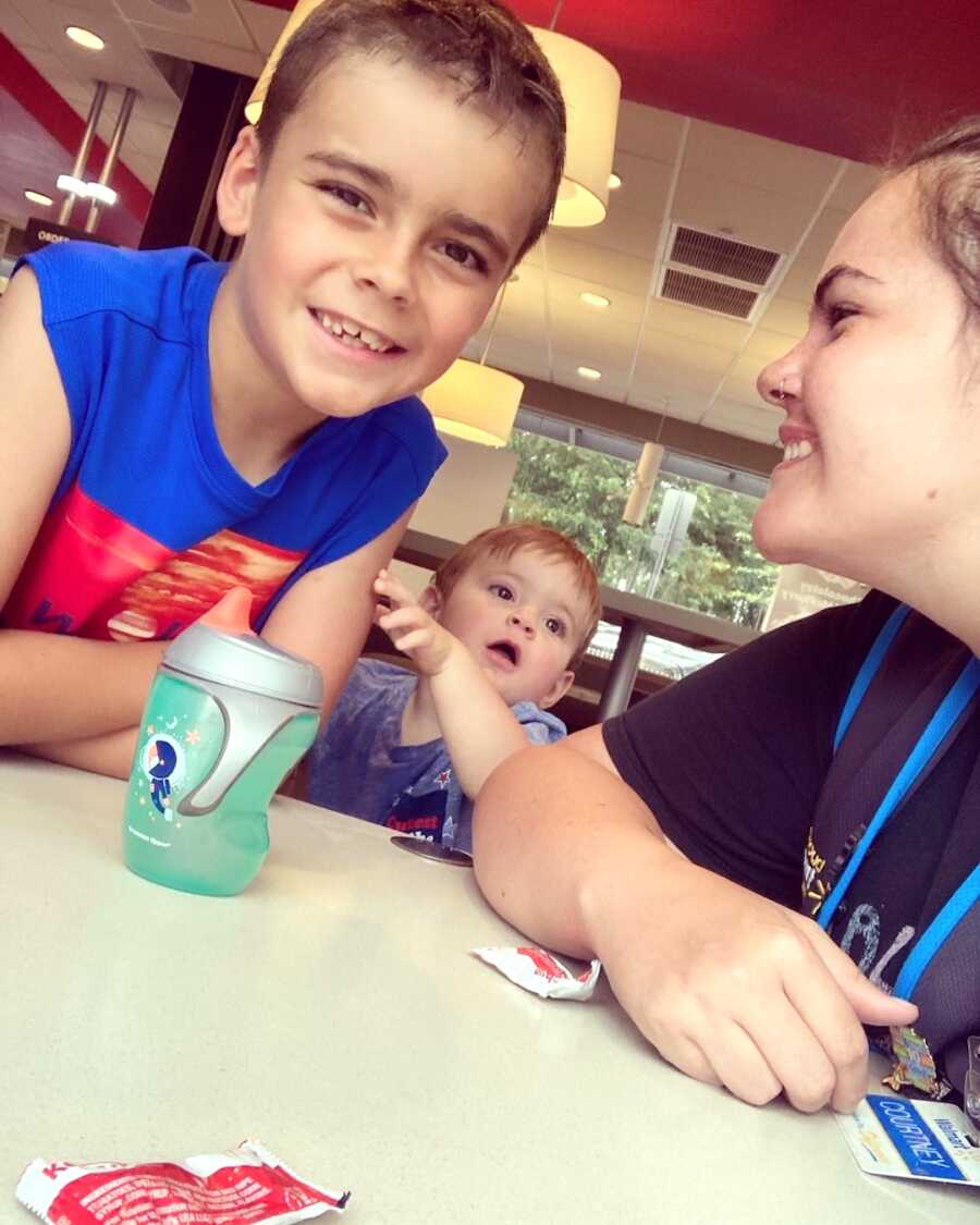 mom takes a selfie with her two sons in foster care during visitation