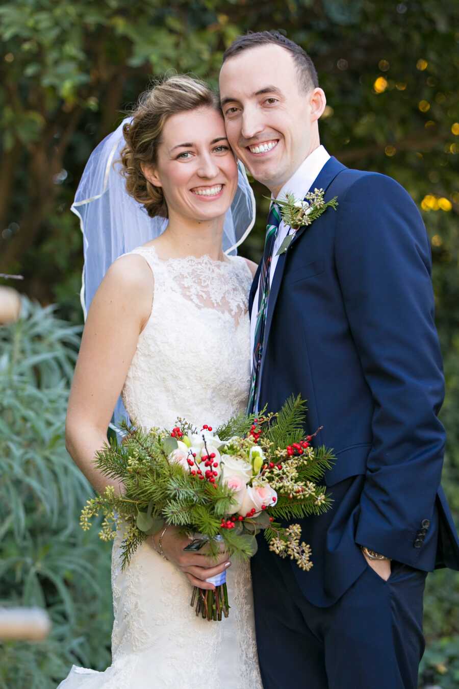 Young couple take wedding picture together.