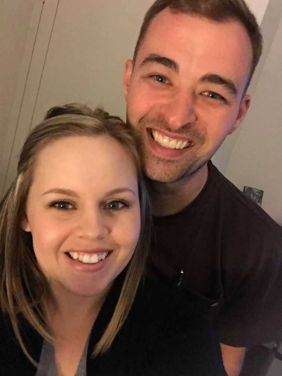 Man takes smiling picture with wife who has since passed away.