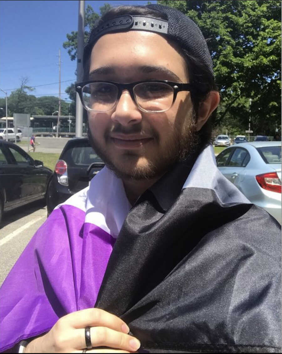 man with flag around neck 