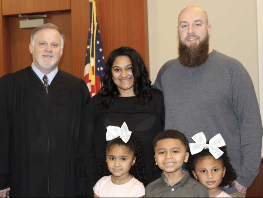 family at adoption with judge 