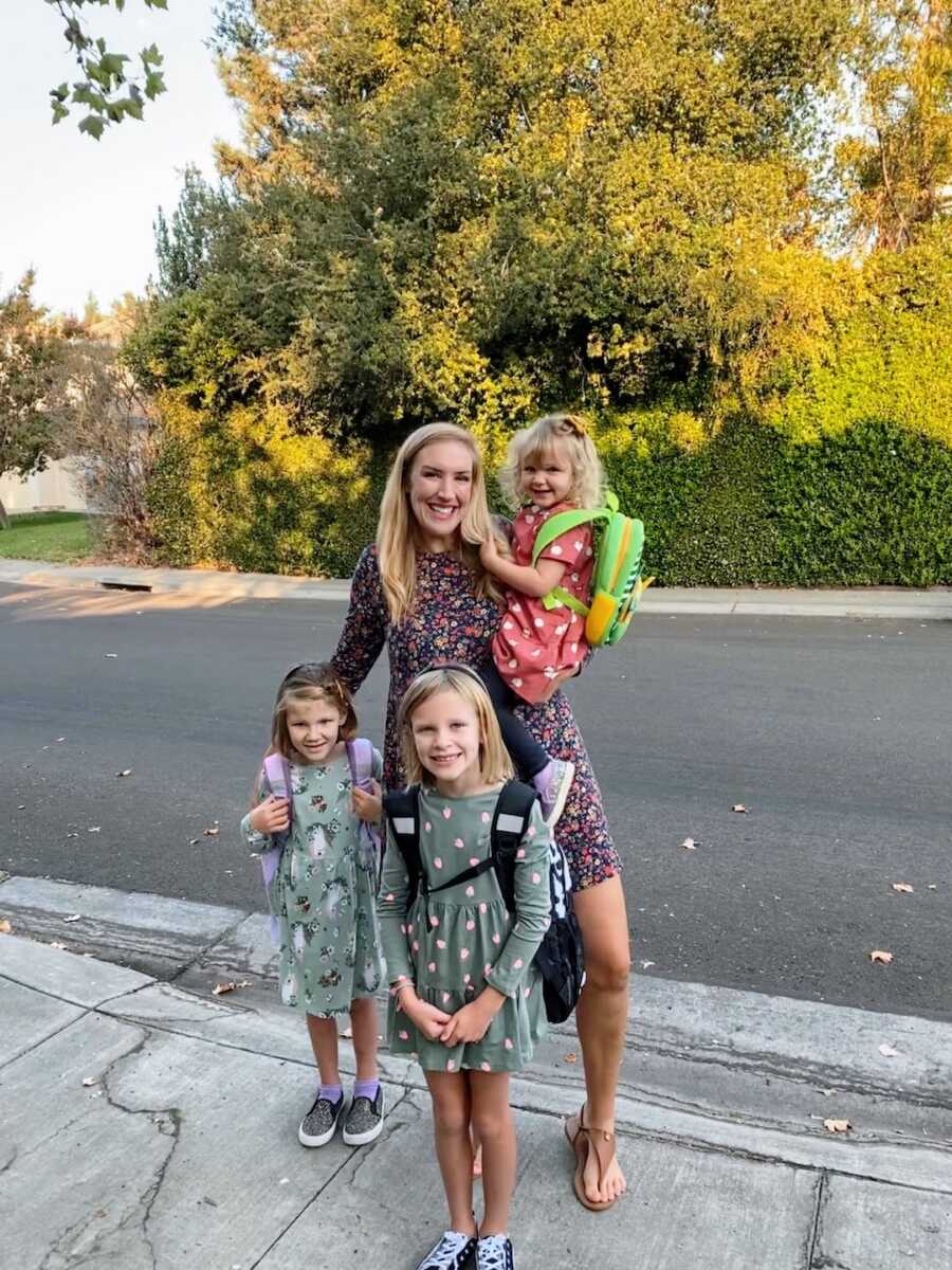 mom with three daughters before school