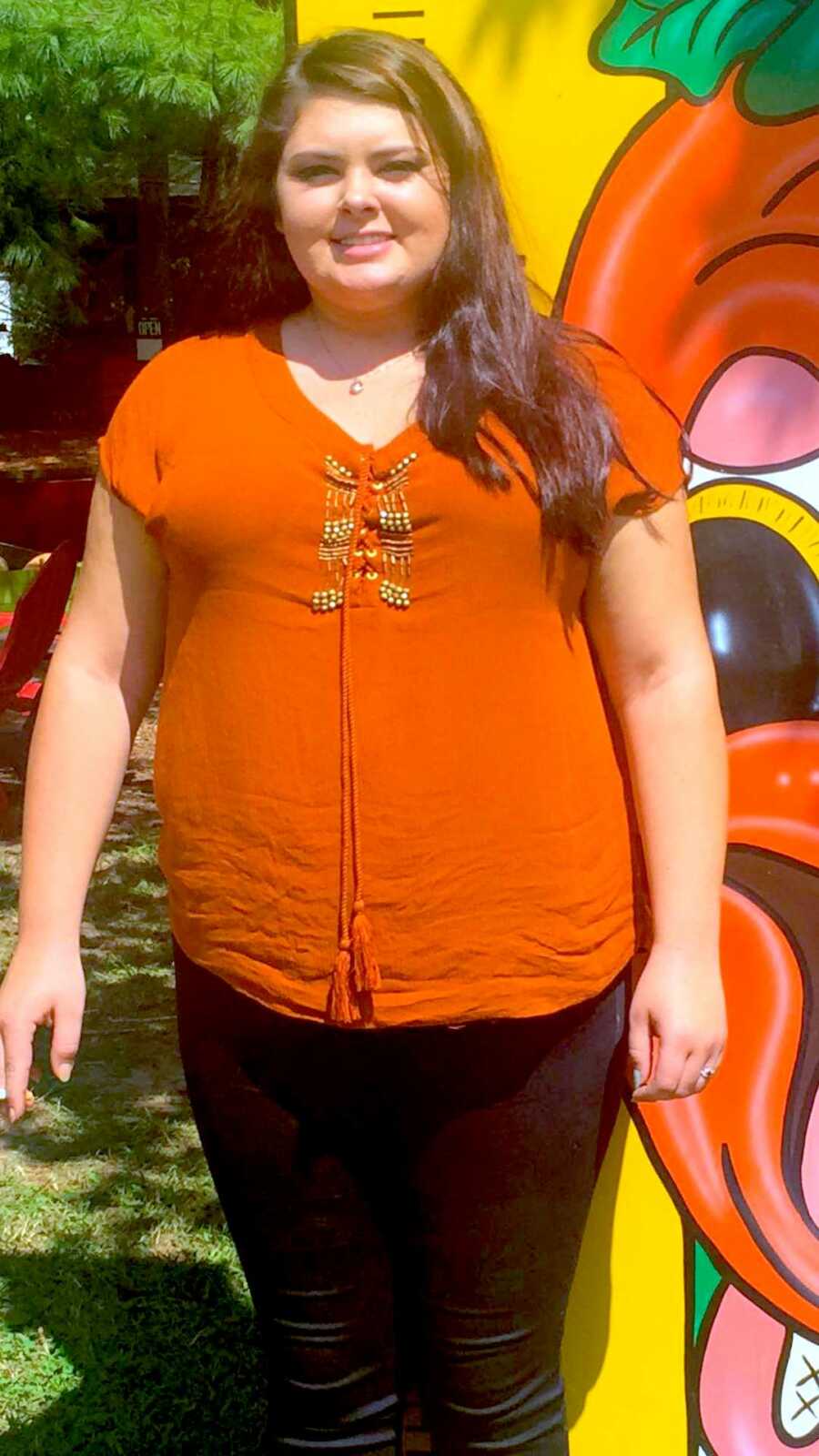 woman standing before starting weight loss journey