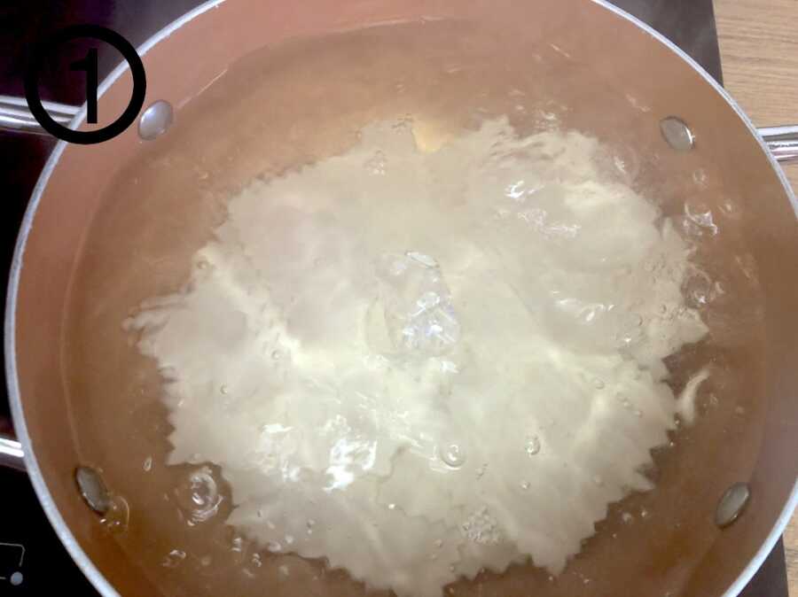 pasta for canelones boiling in pot of water
