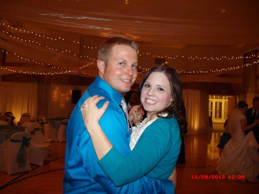 couple embracing one another on the dance floor