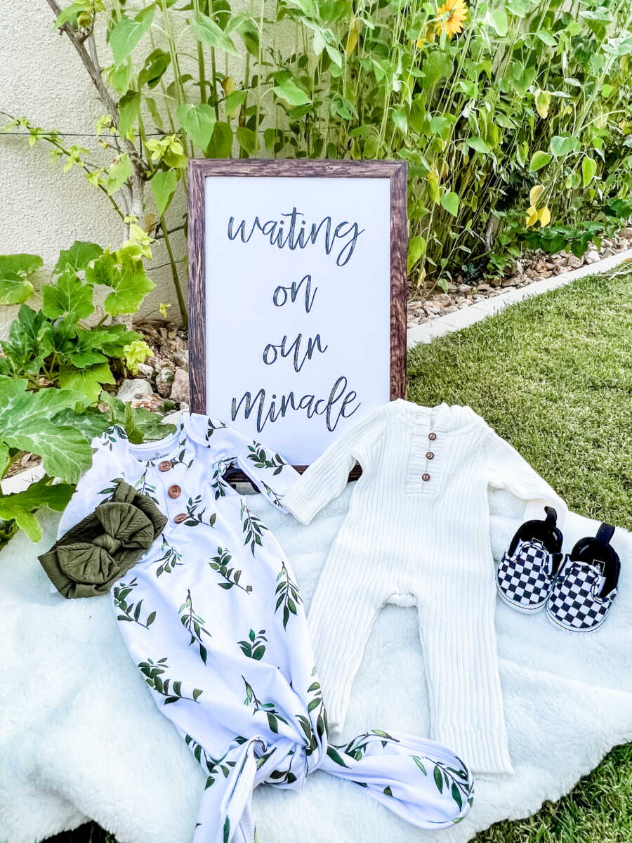 baby onesies with sign saying"waiting on a miracle"