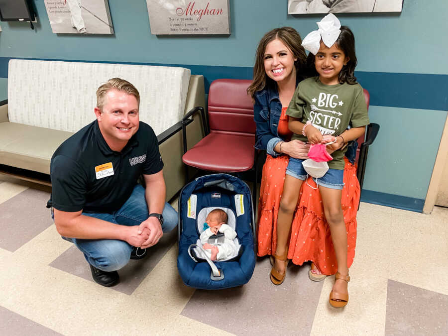 family in hospital with baby they are adopting