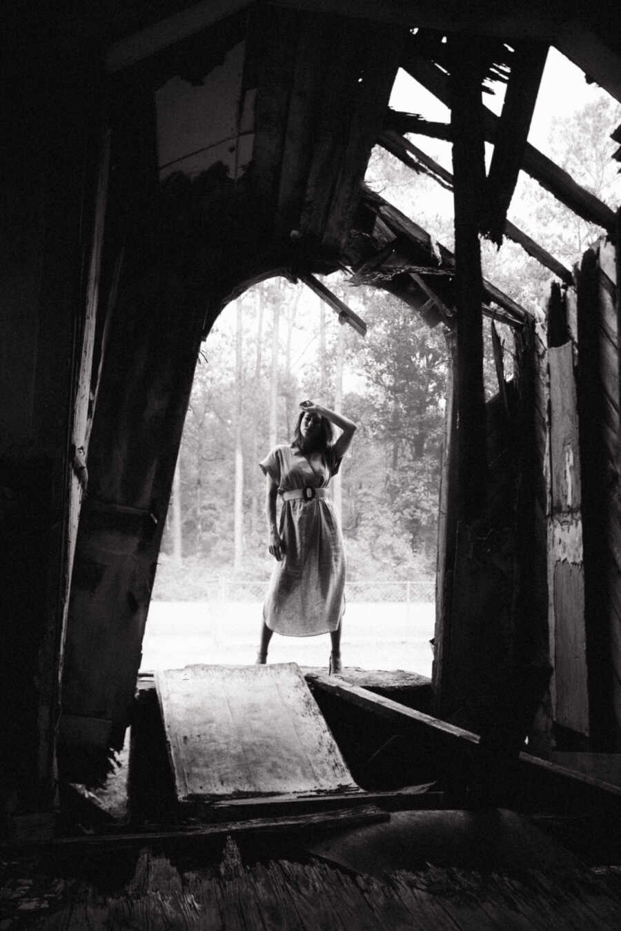 woman standing in an archway