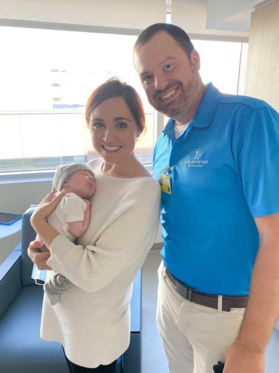 parents happy with their new born son ready to go home