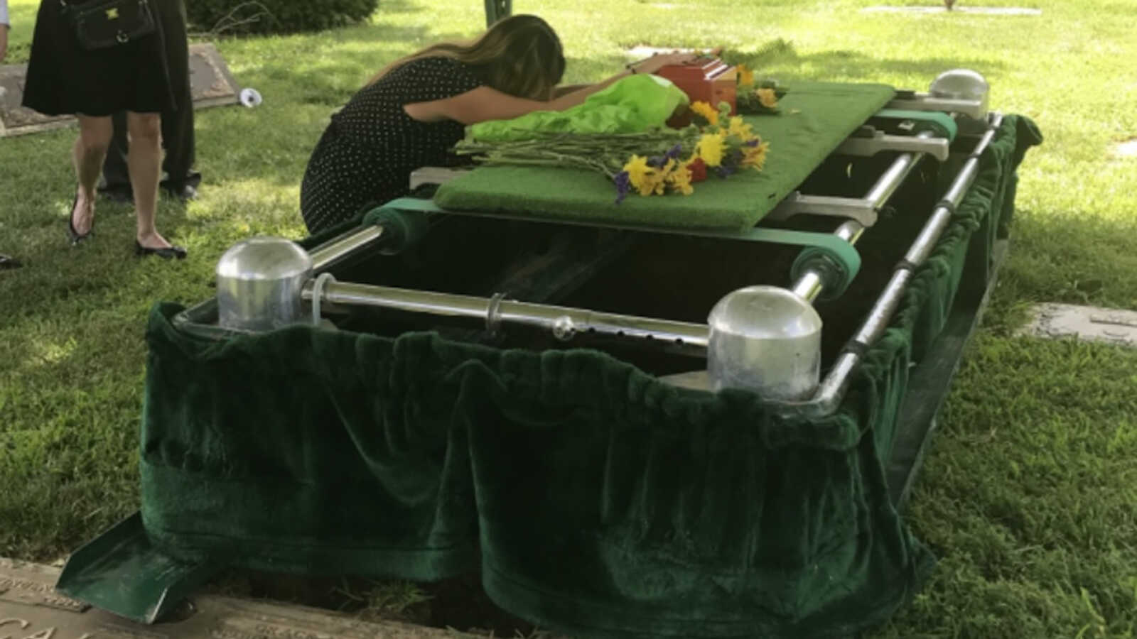 Widow grieves at funeral for husband who died of alcoholism.