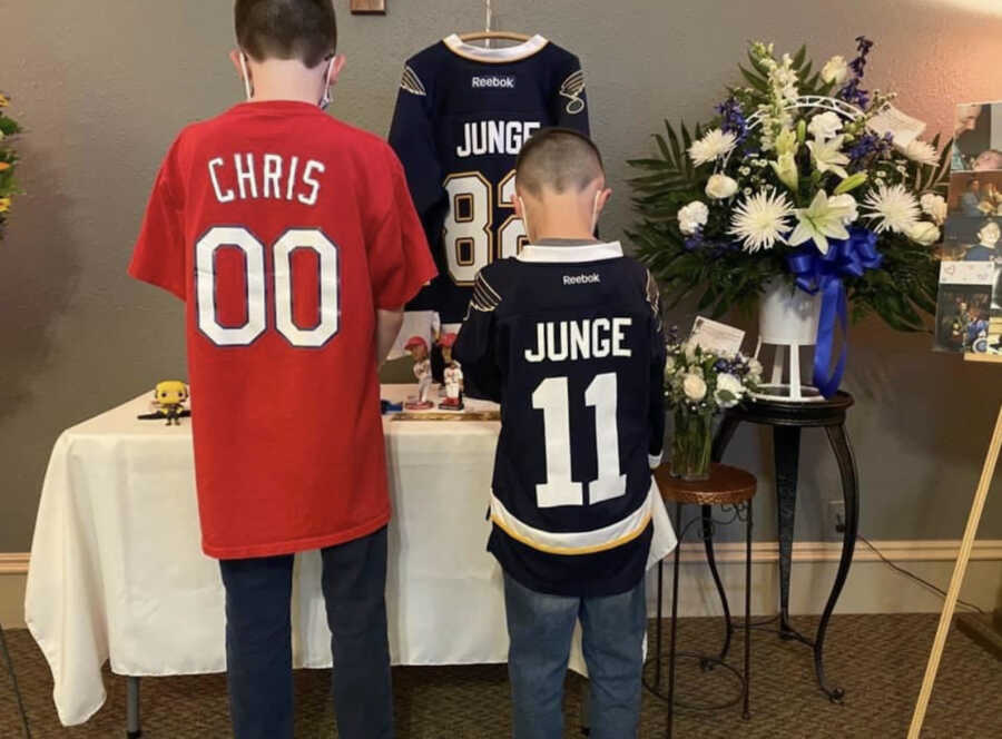 sons at late father's funeral 