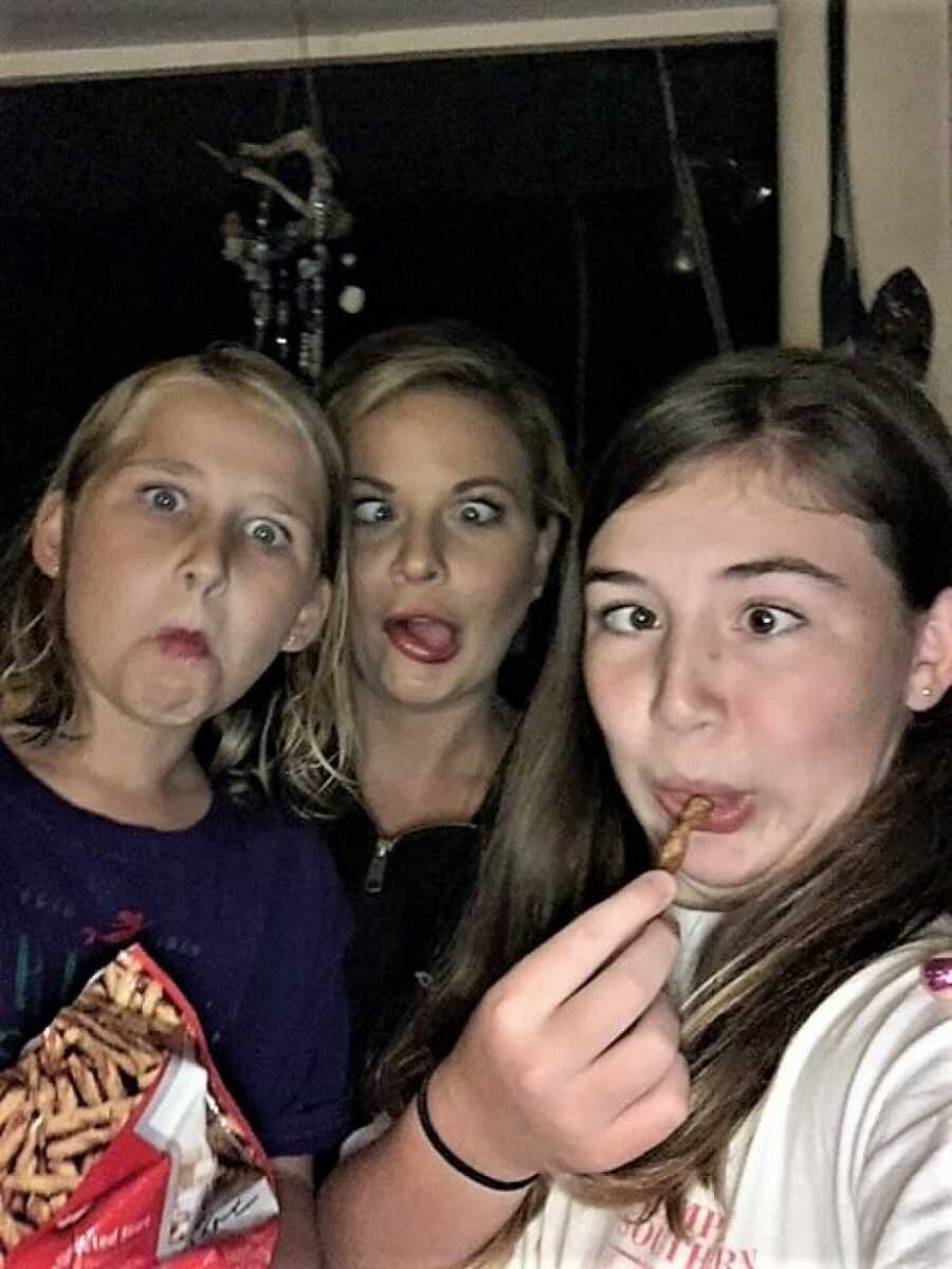 stepmom and daughters making a silly face