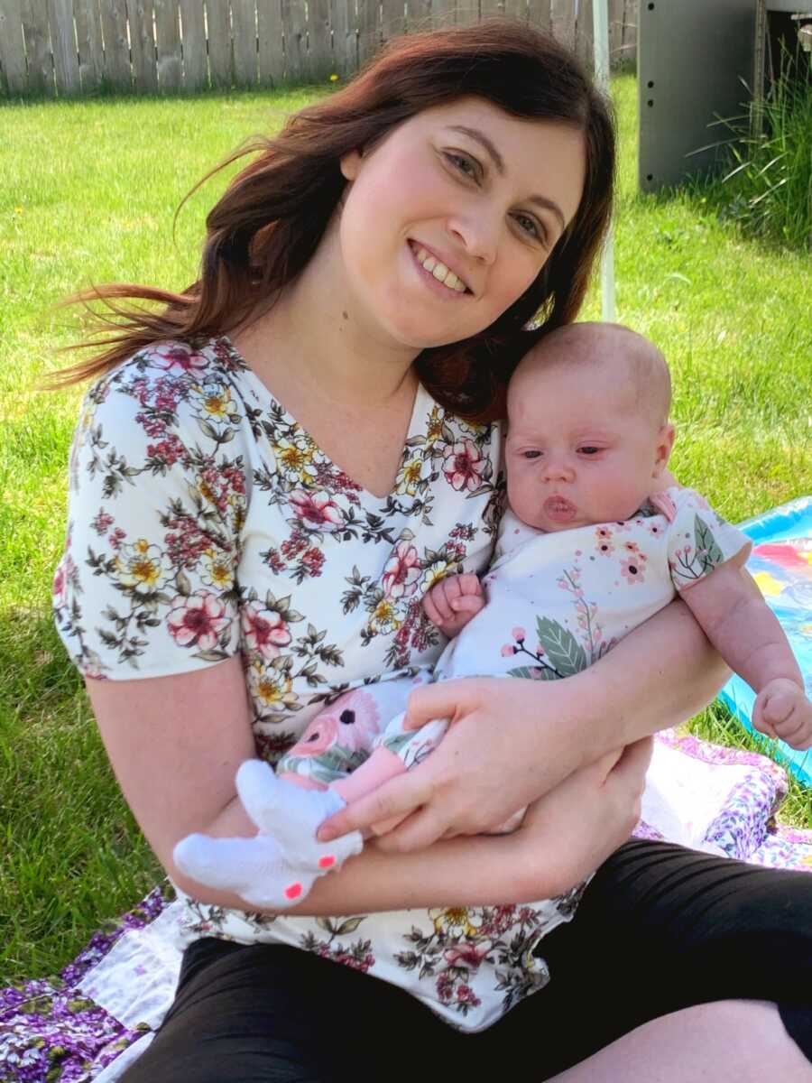 mom and baby daughter having a picnic