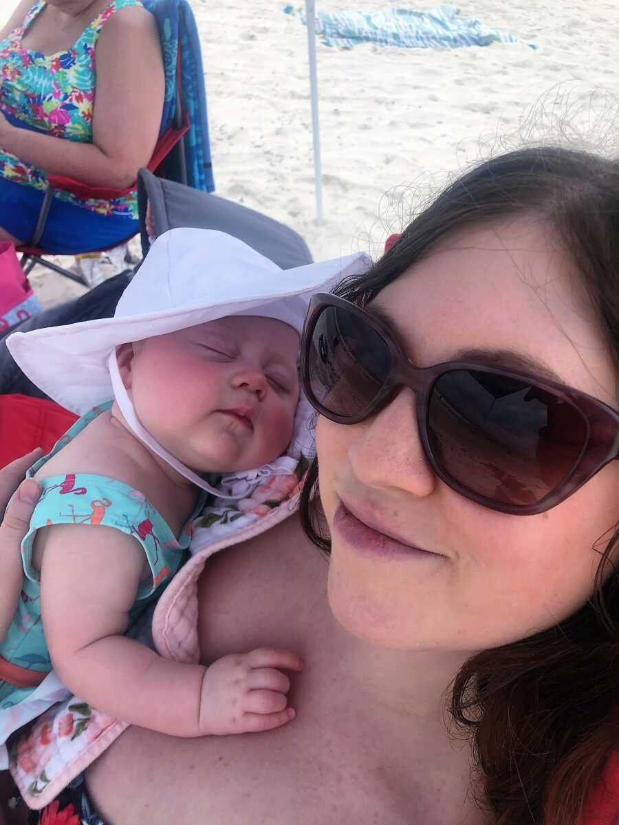 mom holding a sleeping daughter