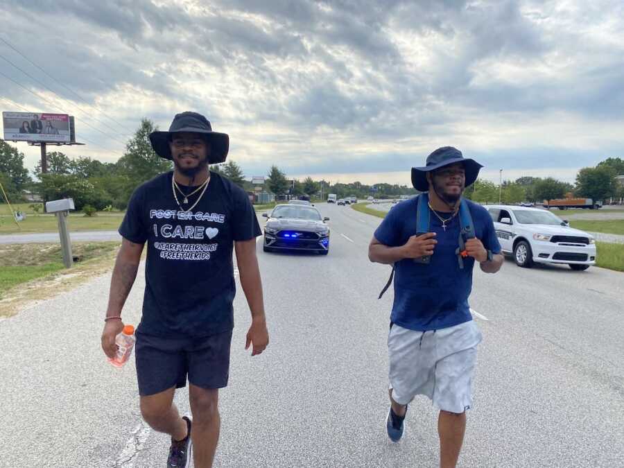 brothers walking down highway 